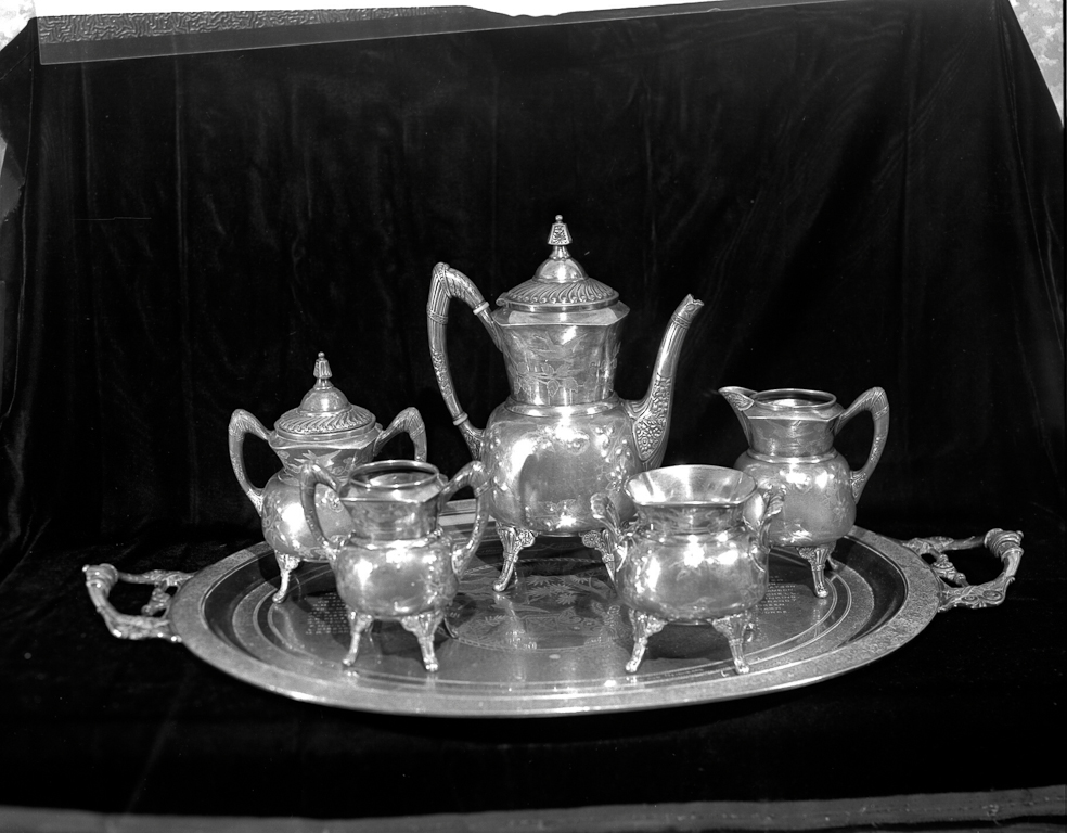 25th Wedding Anniversary -  The early settlers'<br />offering was a beautiful silver set of eight pieces on an elegant tray, on which are engraved the names of the contributors.