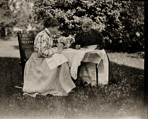 Jennie Squire Redhead and Annie Seymour Redhead enjoying tea outdoors on July 4, 1896